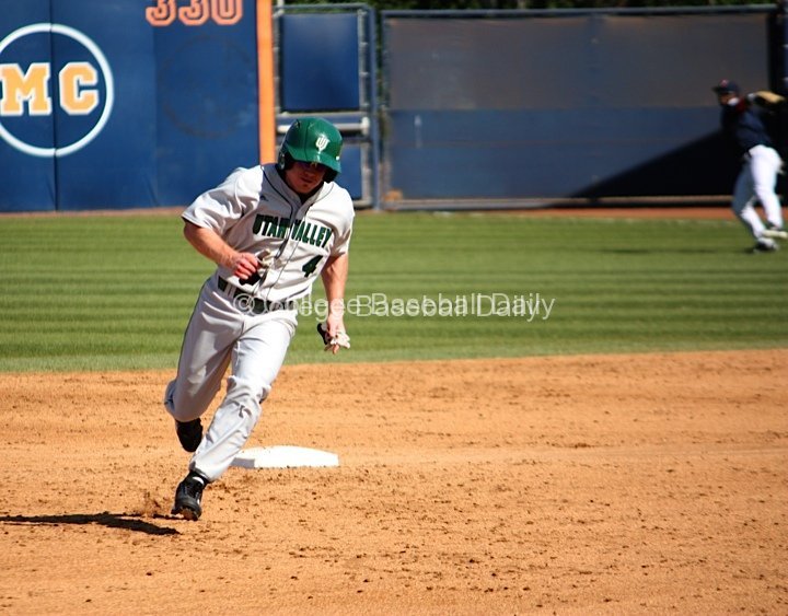 Riley White rounds second as the RF comes up firing