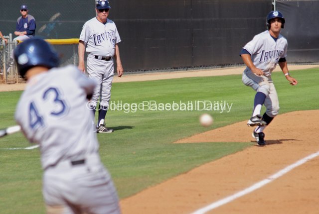 DJ Crumlish watches Jordan Fox bat.