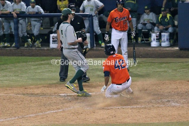 Clay Williamson slides in after a wild pitch.