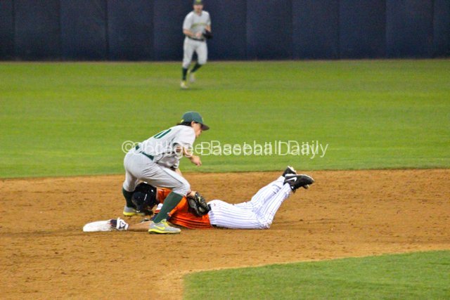 Aaron Payne applies the tag to Matt Chapman.