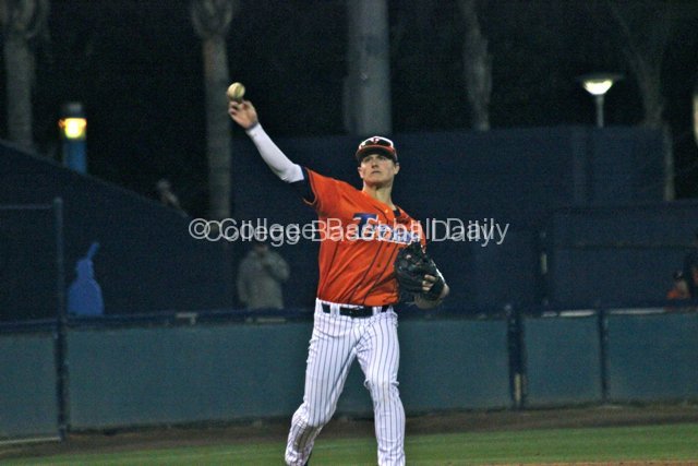 Matt Chapman throws across the diamond.