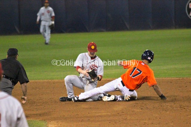 Carlos Lopez is safe as Adam Landecker can't control the ball.