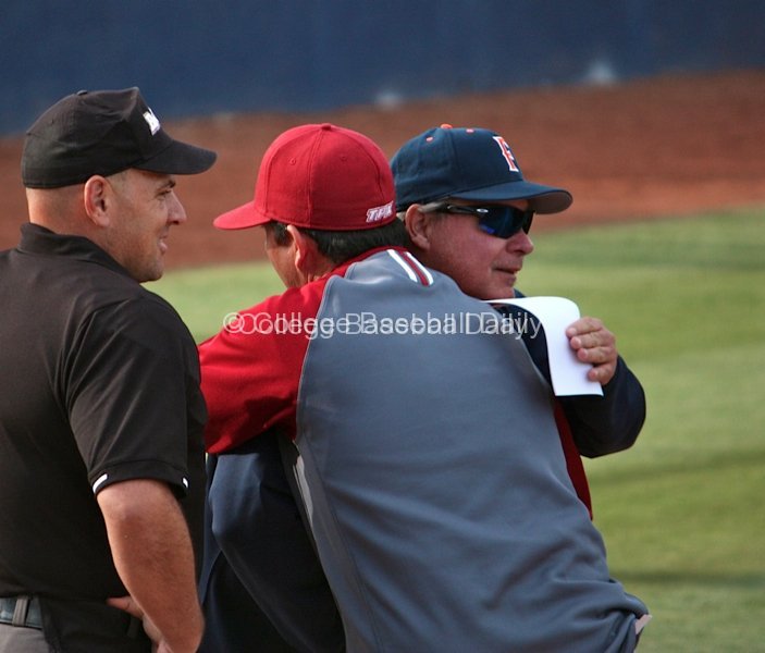 Rich Vanderhook and Jason Gill embrace before the game.