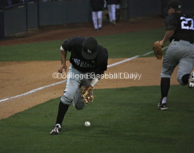 Juan Avila mishandles a bunt.