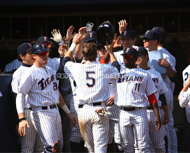 Keegan Dale is greeted after scoring.