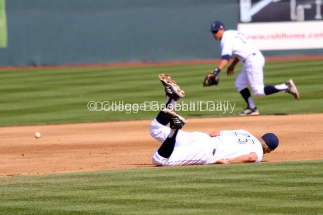 Taylor Sparks watches the ball go through after his diving attempt came up short.