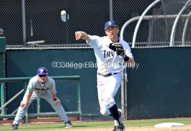 Taylor Sparks charges a ball and throws to first.