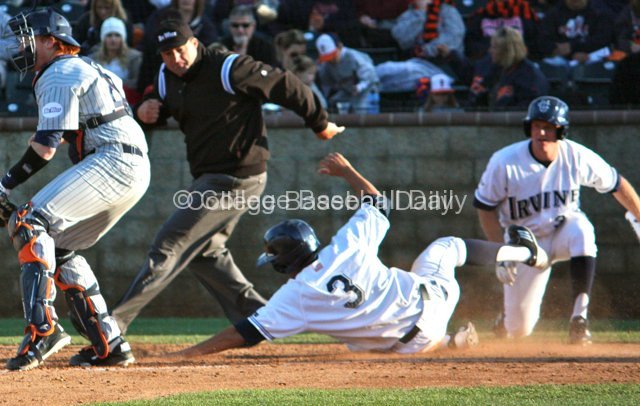 Tommy Reyes slides in safely at home.