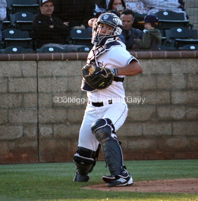 Chris Rabago throws to first on a dropped third strike.