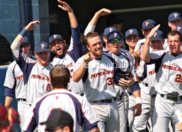 The Pepperdine bench awaits Joe Sever after his three-run HR.