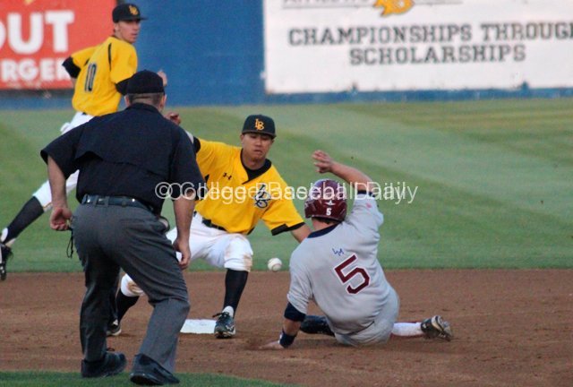 Zac Fujimoto steals second base.