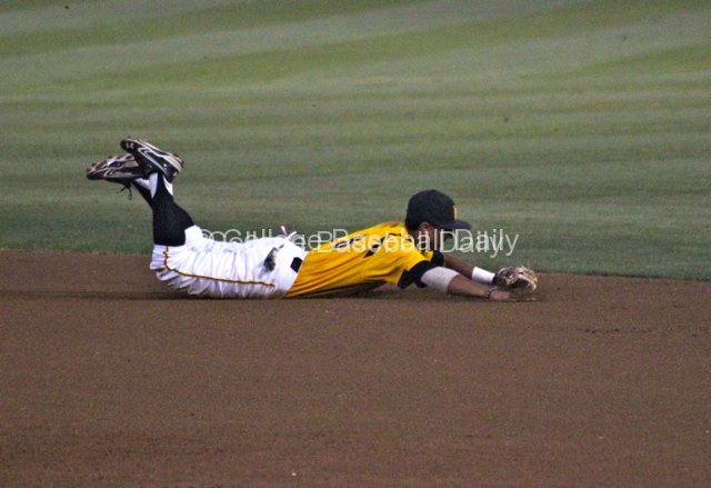 Chaz Meadows makes a diving stop at second base.