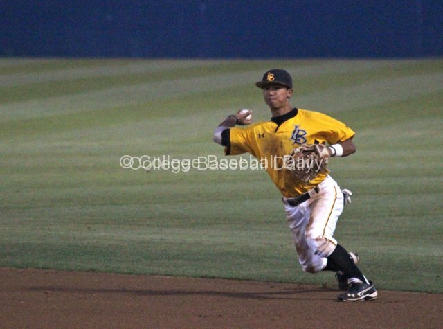 Chaz Meadows throws to first to complete the diving play.