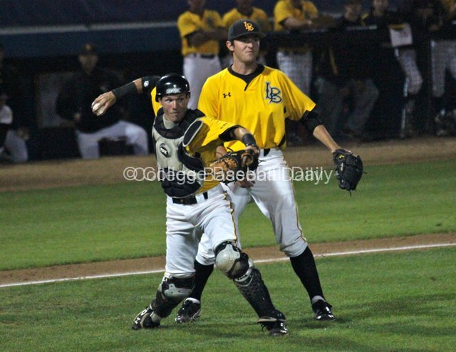 Kellen Hoime fields a chopper in front of the plate.