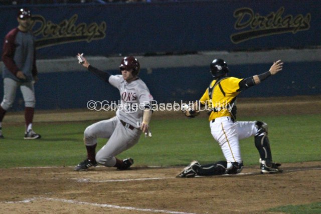 Scott Harkin slides in around the tag attempt of Hoime.