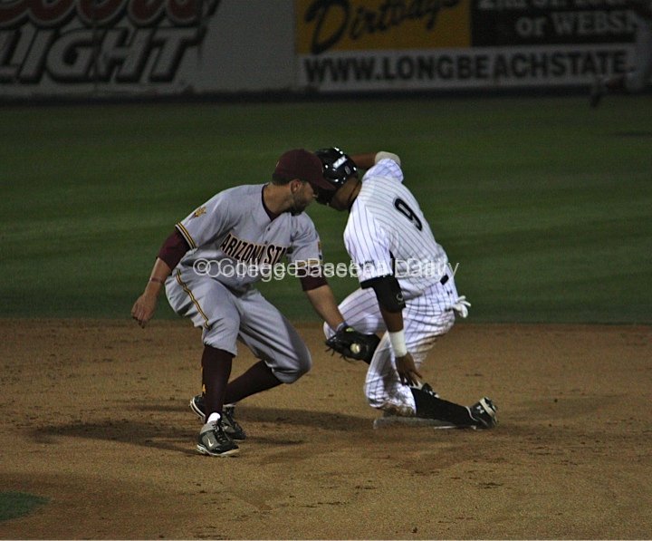 Juan Avila is safe on a delayed steal.