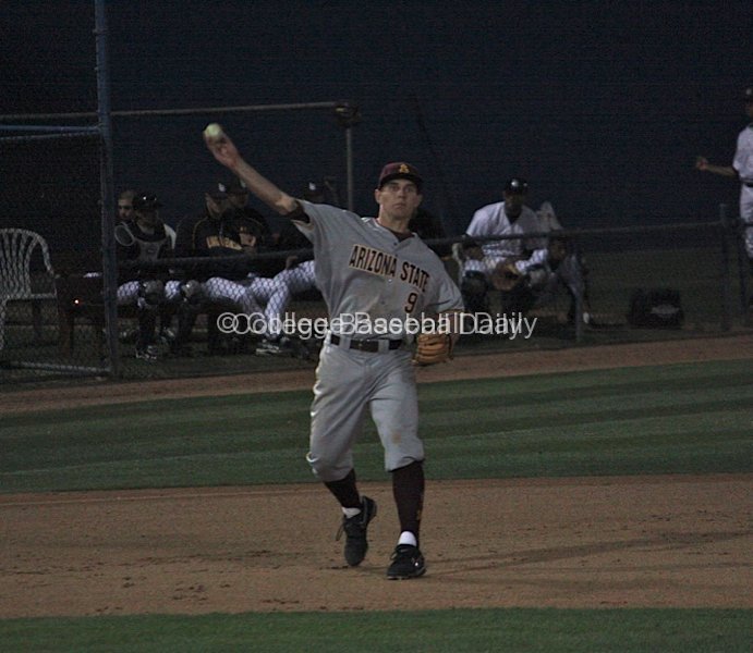 Michael Benjamin throws across the diamond.