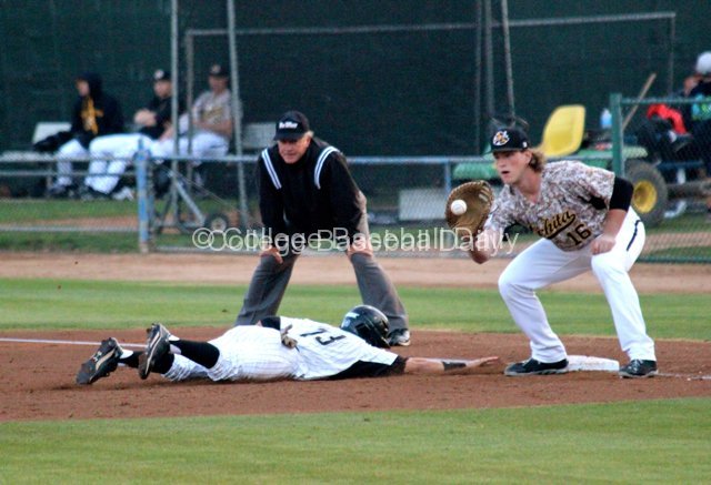 Casey Gillaspie catches a pickoff attempt as Colby Brenner dives in.