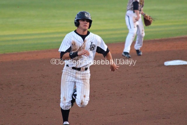 Colby Brenner hustles to third.