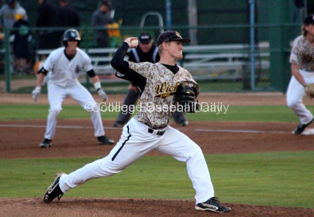 Cale Elam pitches with runners on.