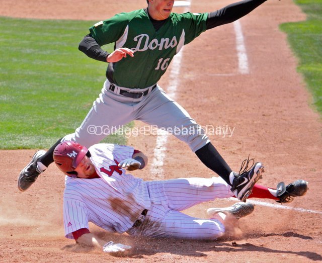 Matt Lowenstein slides in safely after a wild pitch.