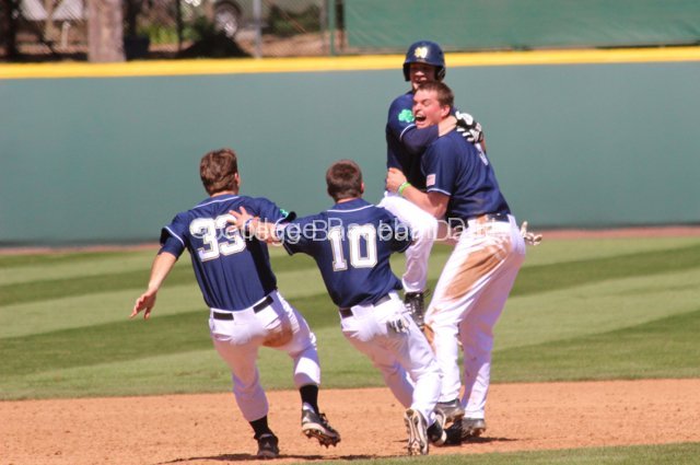 Kevin DeFilippis jumps into Trey Mancini's arms.