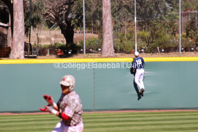 Mac Hudgins watches Garrett Carey's home run.