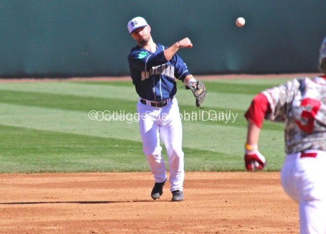 Frank DeSico throws to first.