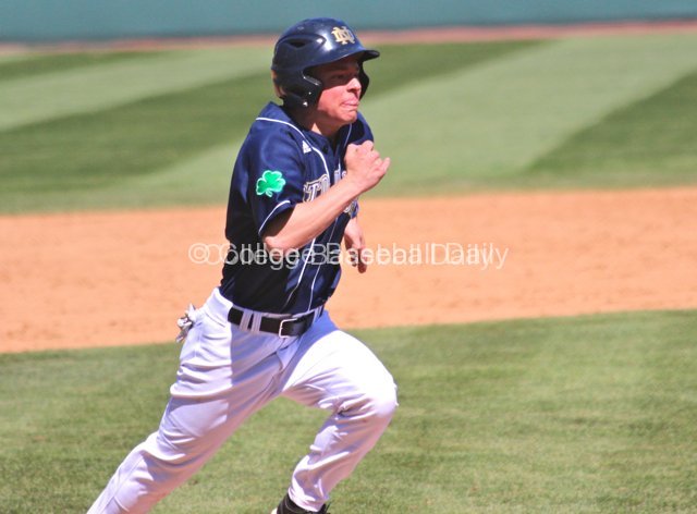 Conor Biggio scores the tying run in the ninth.