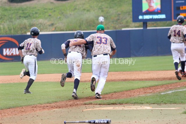 Sam Meyer has to pick up Ranny Lowe after knocking him to the ground.