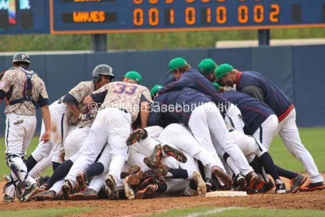 Dogpile atop Drew Hacker.