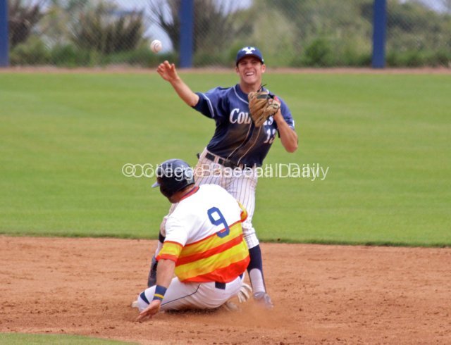 Bret Lopez turns the double play over the sliding runner.