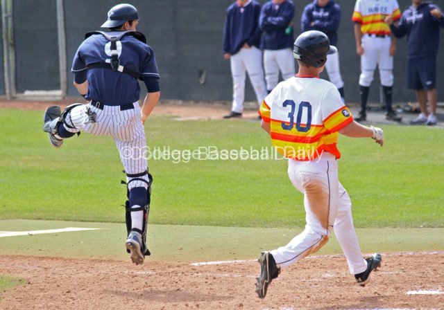 Wes Guenther skies to catch a throw as Bryan Langlois scores.