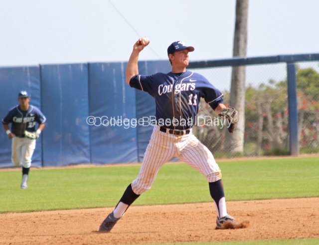 Brock Whitney throws to first.