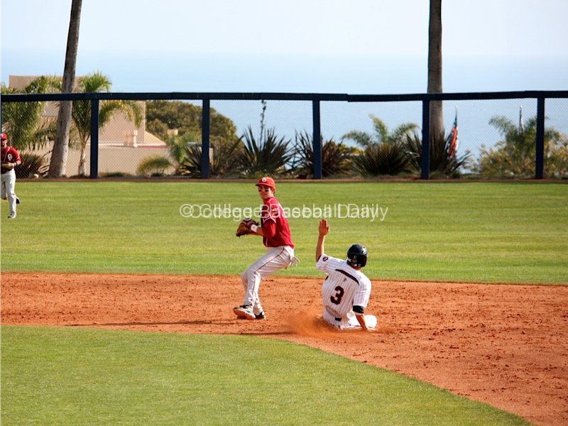 Dustin Dishman attempts to turn a double play