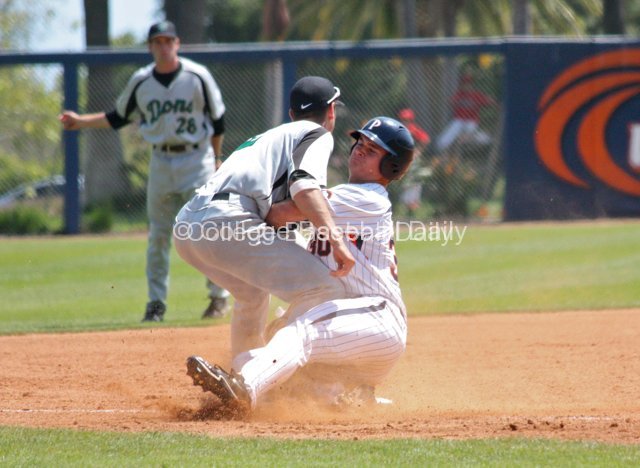 Bryan Langlois collides with Aritz Garcia on a hard slide at 3B.
