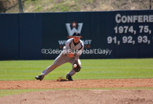Jason Mahood fields a grounder at second base.