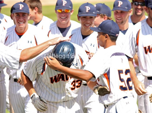 Sam Meyer is mugged in the dugout following his HR.