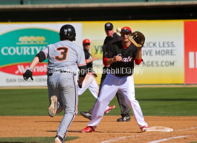 Jonathan Spirk catches a dropped third strike from the catcher.