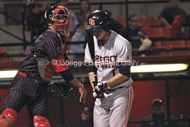 Tyler Smith heads back to the dugout after striking out.