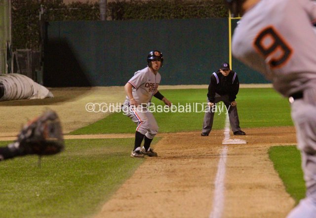 Max Gordon watches as Danny Hayes singles home the winning run.
