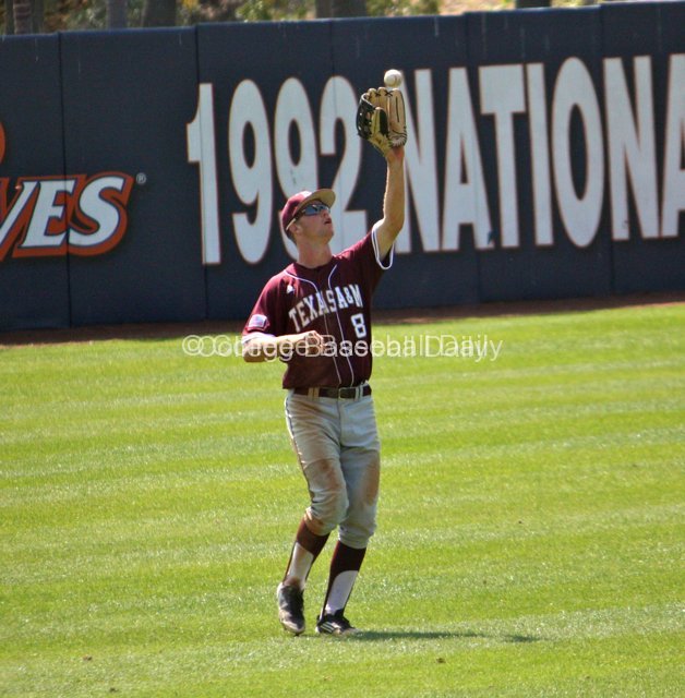 Brandon Wood catches a fly.