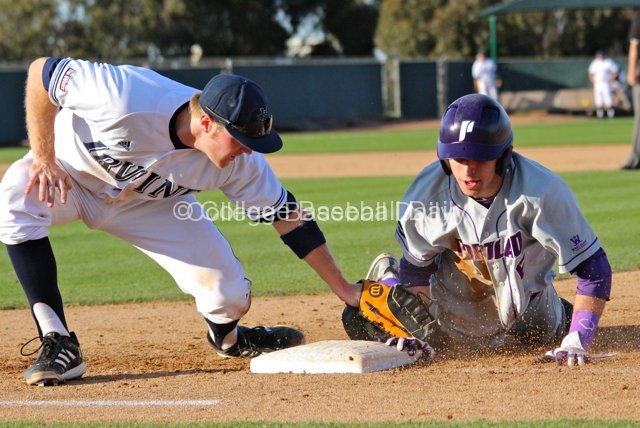 Caleb Whalen dives back before Connor Spencer can apply the tag.