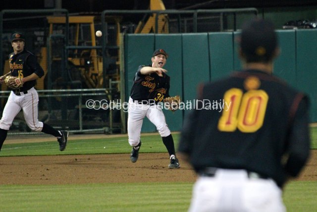 Kevin Swick throws to first to get an out.