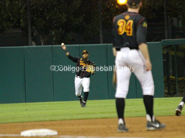 Timmy Robinson tries to throw out a runner at home.