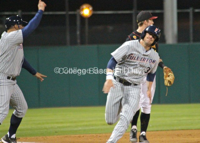 Anthony Hutting rounds third on a Lorenzen triple.