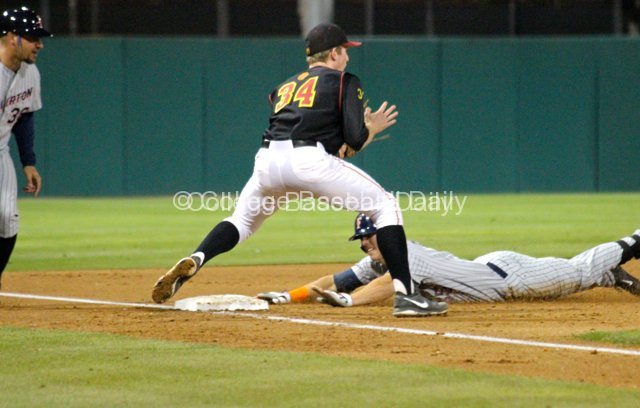 Michael Lorenzen dives into third base with a two-run triple.