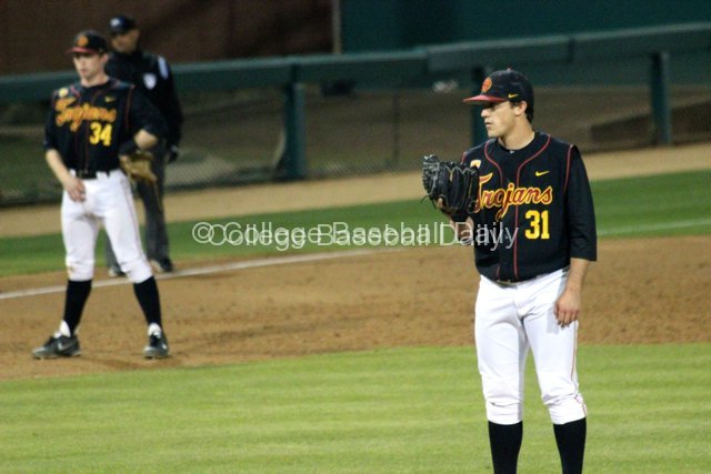 Sean Silva takes a sign.