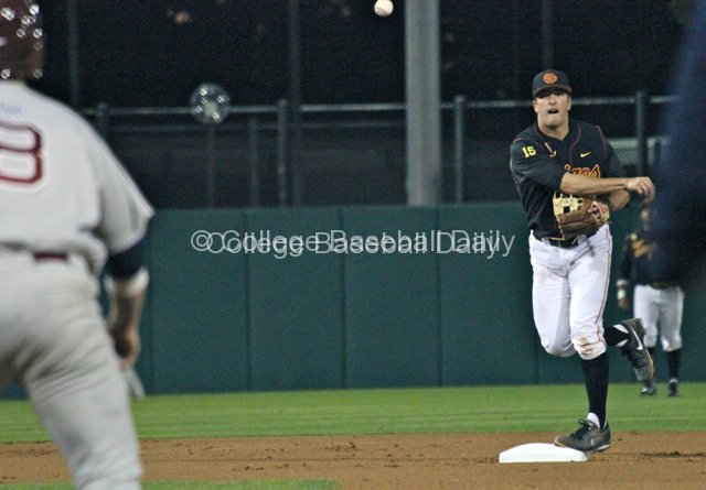 James Roberts throws to first for a double play.