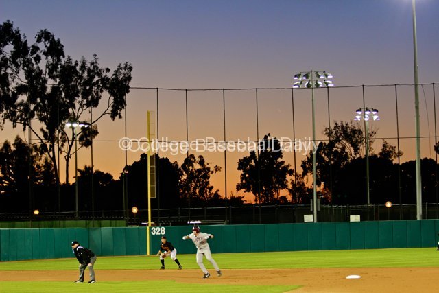 Matt Lowenstein leads off second while the sun sets.